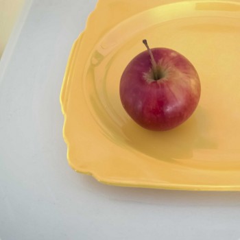 Apple on Yellow Plate